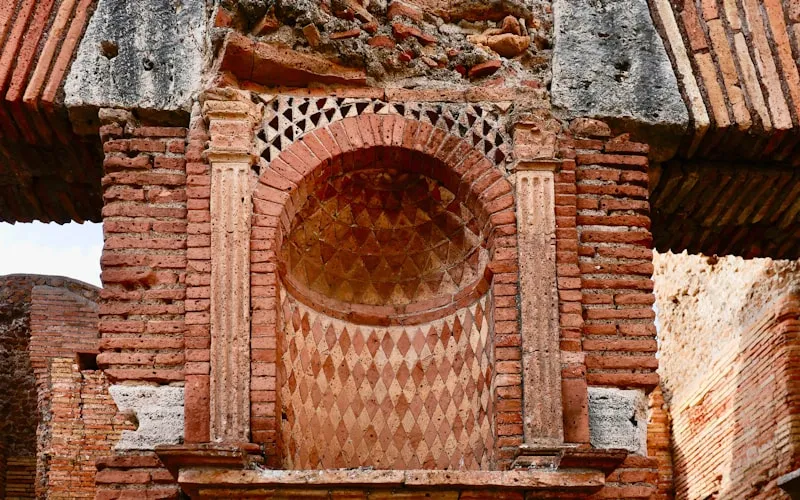 Mediterranean casa interior with terracotta tiles and warm arched doorways