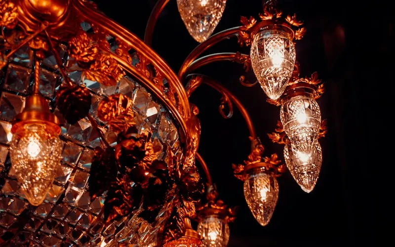 Crystal chandelier and elegant table lamps illuminating a classic interior