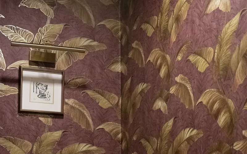 Bold designer wallpaper creating a statement wall in a luxury interior