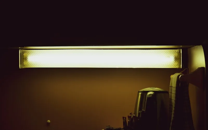 Well-lit office space combining natural light with task and ambient lighting