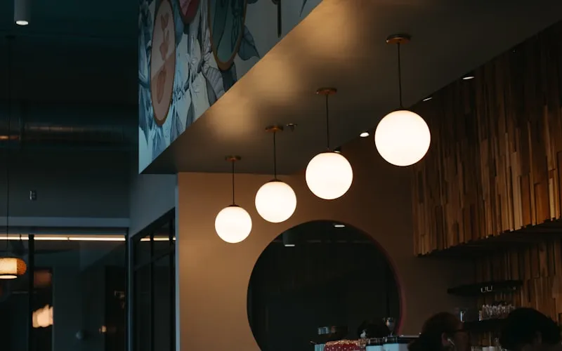 Stylish restaurant bar with modern counter design and statement lighting