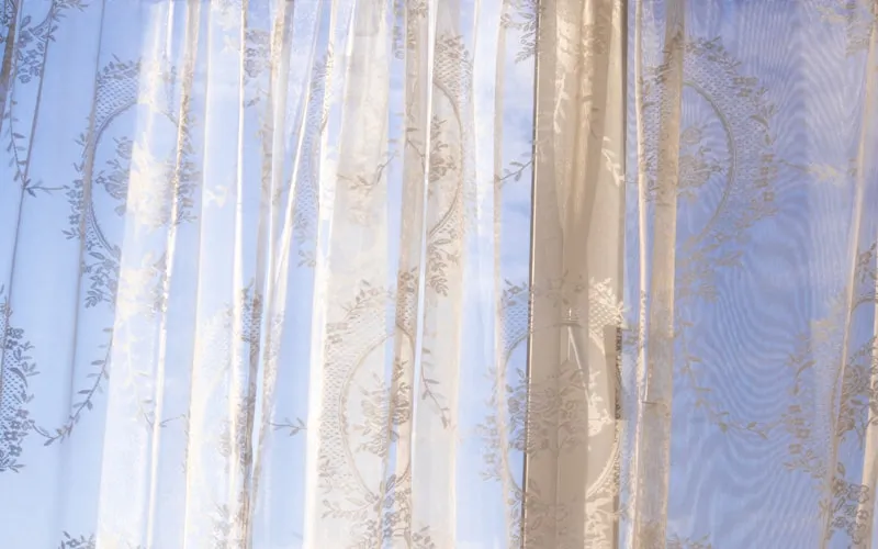 Elegant floor-length curtains and sheer drapes filtering natural light